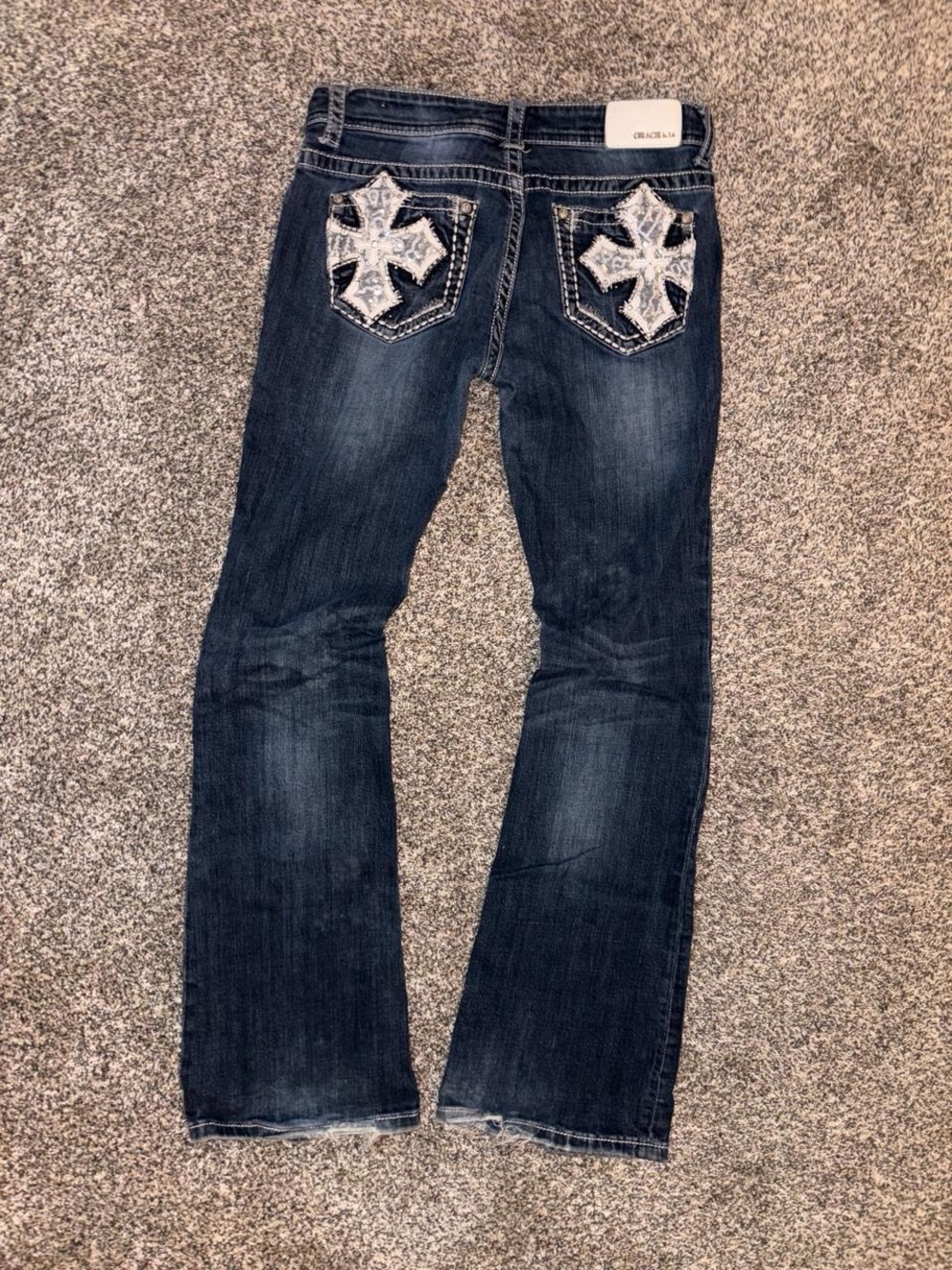 Y2K Grace in LA bootcut jeans with a grunge cross design lace and sequins